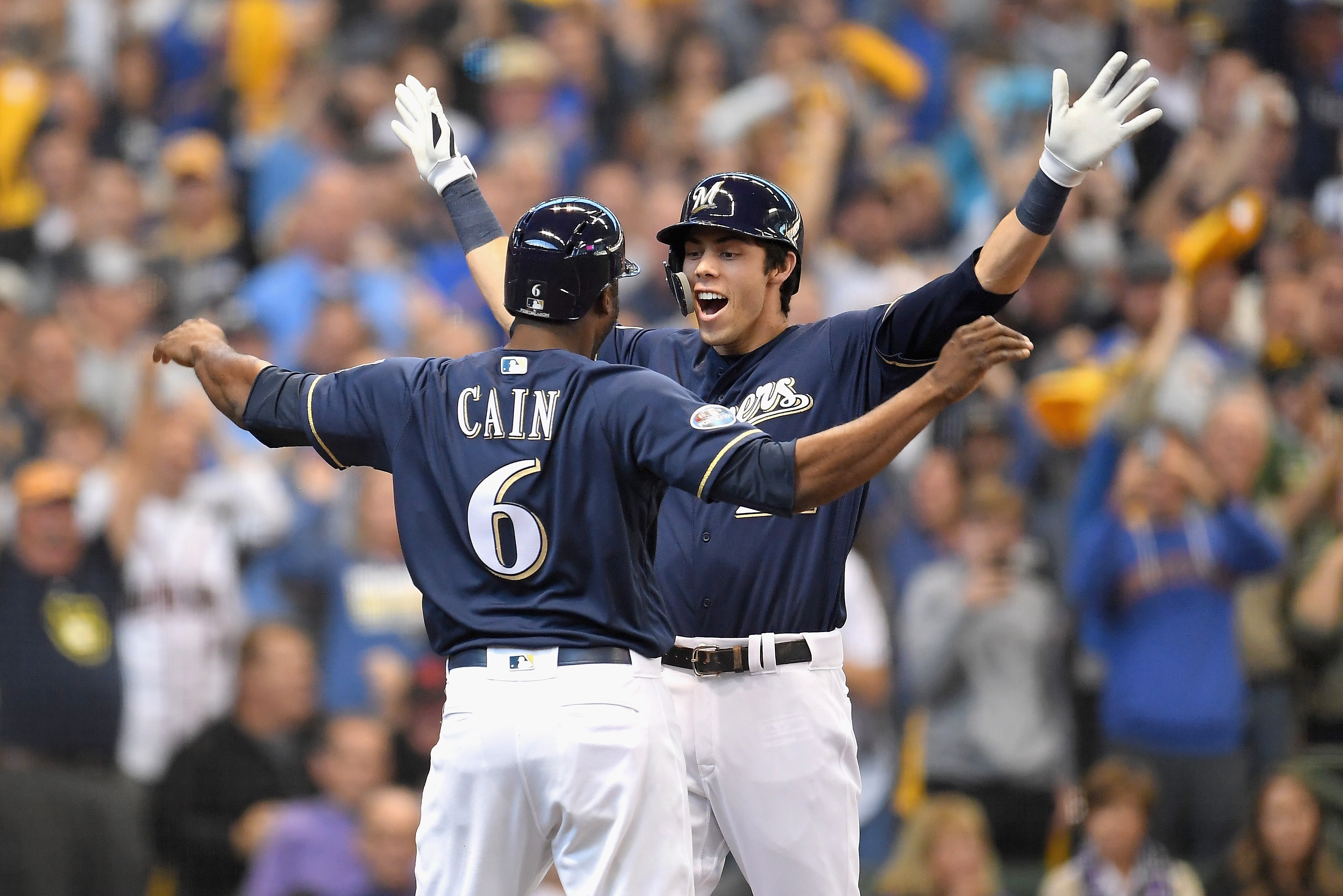 MILWAUKEE, WI - OCTOBER 04:  Christian Yelich #22 of the Milwaukee Brewers and Lorenzo Cain #6 celebrate after Yelich hit his two-run homerun in the third inning of Game One of the National League Division Series against the Colorado Rockies at Miller Park on October 4, 2018 in Milwaukee, Wisconsin.  (Photo by Stacy Revere/Getty Images)