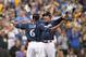 MILWAUKEE, WI - OCTOBER 04: Christian Yelich #22 of the Milwaukee Brewers and Lorenzo Cain #6 celebrate after Yelich hit his two-run homerun in the third inning of Game One of the National League Division Series against the Colorado Rockies at Miller Park on October 4, 2018 in Milwaukee, Wisconsin. (Photo by Stacy Revere/Getty Images)