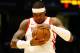 Houston Rockets forward Carmelo Anthony (7) rubs the ball before the start of the game against the Memphis Grizzlies during the first half of a preseason NBA basketball game, Tuesday, Oct. 2, 2018, in Birmingham, Ala. (AP Photo/Butch Dill)
