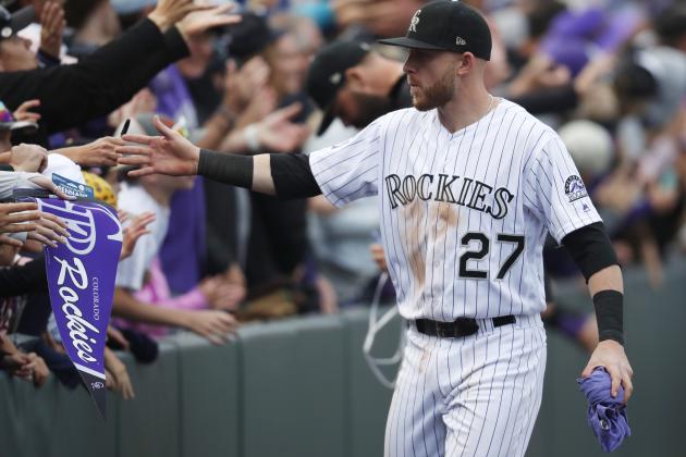 Colorado Rockies shortstop Trevor Story is congratulated by fans after the ninth inning of a baseball game against the Washington Nationals Sunday, Sept. 30, 2018, in Denver. The Rockies won 12-0. (AP Photo/David Zalubowski)
