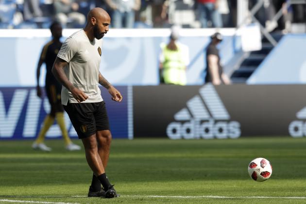 Belgium assistant coach Thierry Henry kicks a ball as the team warms up ahead of the third place match between England and Belgium at the 2018 soccer World Cup in the St. Petersburg Stadium in St. Petersburg, Russia, Saturday, July 14, 2018. (AP Photo/Petr David Josek)