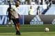 Belgium assistant coach Thierry Henry kicks a ball as the team warms up ahead of the third place match between England and Belgium at the 2018 soccer World Cup in the St. Petersburg Stadium in St. Petersburg, Russia, Saturday, July 14, 2018. (AP Photo/Petr David Josek)