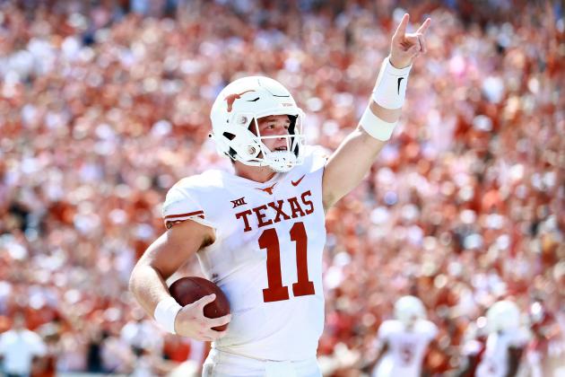 DALLAS, TX - OCTOBER 06:  Sam Ehlinger #11 of the Texas Longhorns celebrates after scoring a touchdown against the Oklahoma Sooners in the third quarter of the 2018 AT&T Red River Showdown at Cotton Bowl on October 6, 2018 in Dallas, Texas.  (Photo by Tom Pennington/Getty Images)