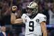 New Orleans Saints quarterback Drew Brees (9) reacts after throwing a touchdown pass in the first half of an NFL football game in New Orleans, Monday, Oct. 8, 2018. (AP Photo/Butch Dill)