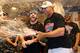 NEW YORK, NEW YORK - OCTOBER 09: Alex Cora #20 of the Boston Red Sox celebrates in the locker room with his team after defeating the New York Yankees to win Game Four American League Division Series by a score of 4-3 at Yankee Stadium on October 09, 2018 in the Bronx borough of New York City. (Photo by Elsa/Getty Images)