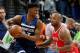 Minnesota Timberwolves' Jimmy Butler, left, keeps the ball close as Houston Rockets' PJ Tucker defends during the second half of Game 3 in an NBA basketball first-round playoff series Saturday, April 21, 2018, in Minneapolis. (AP Photo/Jim Mone)