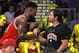 Chicago Bulls guard Jimmy Butler, left, talks with actor Mark Wahlberg during the first half of an NBA basketball game between the Los Angeles Lakers and the Bulls, Thursday, Jan. 28, 2016, in Los Angeles. (AP Photo/Mark J. Terrill)