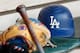 OAKLAND, CA - AUGUST 07: A batting helmet sits in the Los Angeles Dodgers dugout before the game against the Oakland Athletics at Oakland Alameda Coliseum on August 7, 2018 in Oakland, California. (Photo by Lachlan Cunningham/Getty Images)
