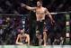 LAS VEGAS, NV - OCTOBER 06: (R-L) Khabib Nurmagomedov of Russia reacts after submitting Conor McGregor of Ireland in their UFC lightweight championship bout during the UFC 229 event inside T-Mobile Arena on October 6, 2018 in Las Vegas, Nevada. (Photo by Jeff Bottari/Zuffa LLC/Zuffa LLC via Getty Images)