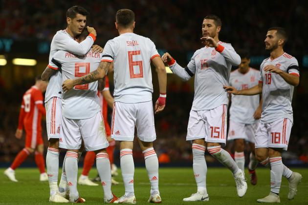 Spain's striker Paco Alcacer (2L) celebrates scoring his team's third goal, his second, with Spain's striker Alvaro Morata (L) during the international friendly football match between Wales and Spain at The Principality Stadium in Cardiff, south Wales, on October 11, 2018. (Photo by GEOFF CADDICK / AFP)        (Photo credit should read GEOFF CADDICK/AFP/Getty Images)