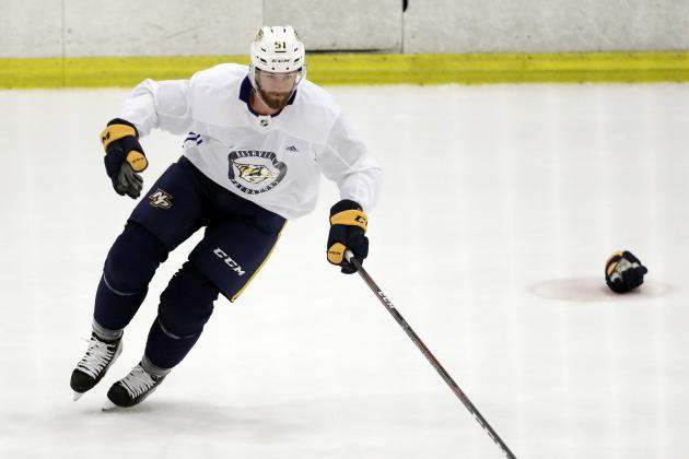Nashville Predators left wing Austin Watson skates with the puck during NHL hockey training camp Saturday, Sept. 15, 2018, in Nashville, Tenn. Watson has been suspended 27 games without pay by the NHL because of a domestic assault charge. (AP Photo/Mark Humphrey)