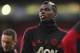 Manchester United's Paul Pogba takes part in the warm up ahead of the English Premier League soccer match between Manchester United and Newcastle United at Old Trafford in Manchester, England, Saturday, Oct. 6, 2018. (AP Photo/Jon Super)