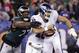 Philadelphia Eagles defensive end Michael Bennett (77) strips the ball from New York Giants quarterback Eli Manning during the first half of an NFL football game Thursday, Oct. 11, 2018, in East Rutherford, N.J. (AP Photo/Julio Cortez)