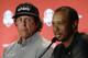 Phil Mickelson, left, listens to Tiger Woods speak during a news conference where they were announced as captain's picks for the 2018 U.S. Ryder Cup Team, Tuesday, Sept. 4, 2018, in West Conshohocken, Pa. (AP Photo/Matt Slocum)
