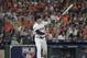Houston Astros' Alex Bregman watches his solo home run against the Cleveland Indians' Corey Kluber during the fourth inning in Game 1 of an American League Division Series baseball game, Friday, Oct. 5, 2018, in Houston. (AP Photo/David J. Phillip)