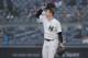 New York Yankees pitcher Sonny Gray adjusts his cap as he watches a two-run home run by Minnesota Twins designated hitter Miguel Sano sail over the center field wall during the first inning of a baseball game, Wednesday, April 25, 2018, in New York. (AP Photo/Julie Jacobson)