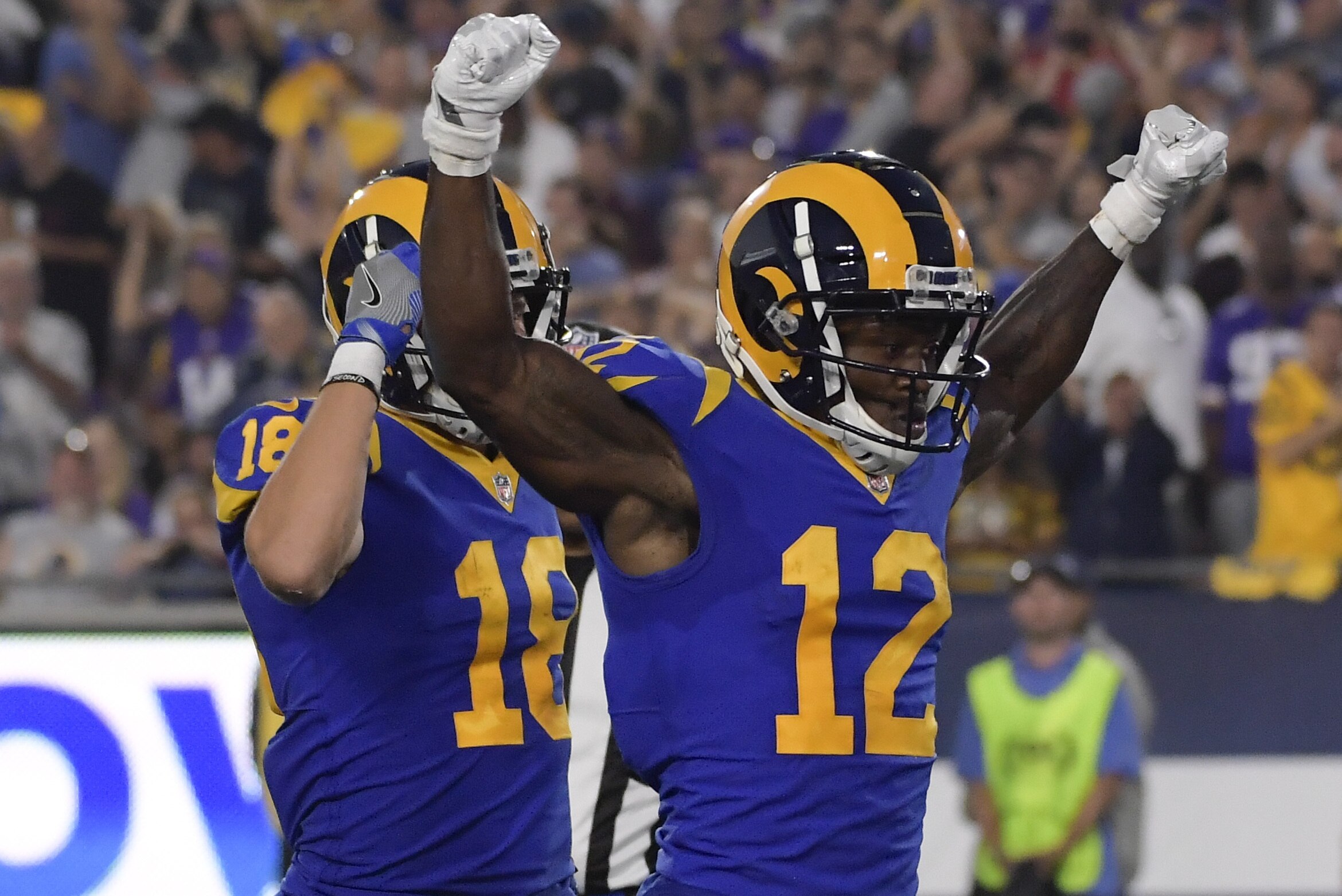 Los Angeles Rams wide receiver Brandin Cooks celebrates after scoring with Cooper Kupp during the first half in an NFL football game against the Minnesota Vikings Thursday, Sept. 27, 2018, in Los Angeles. (AP Photo/Mark J. Terrill)