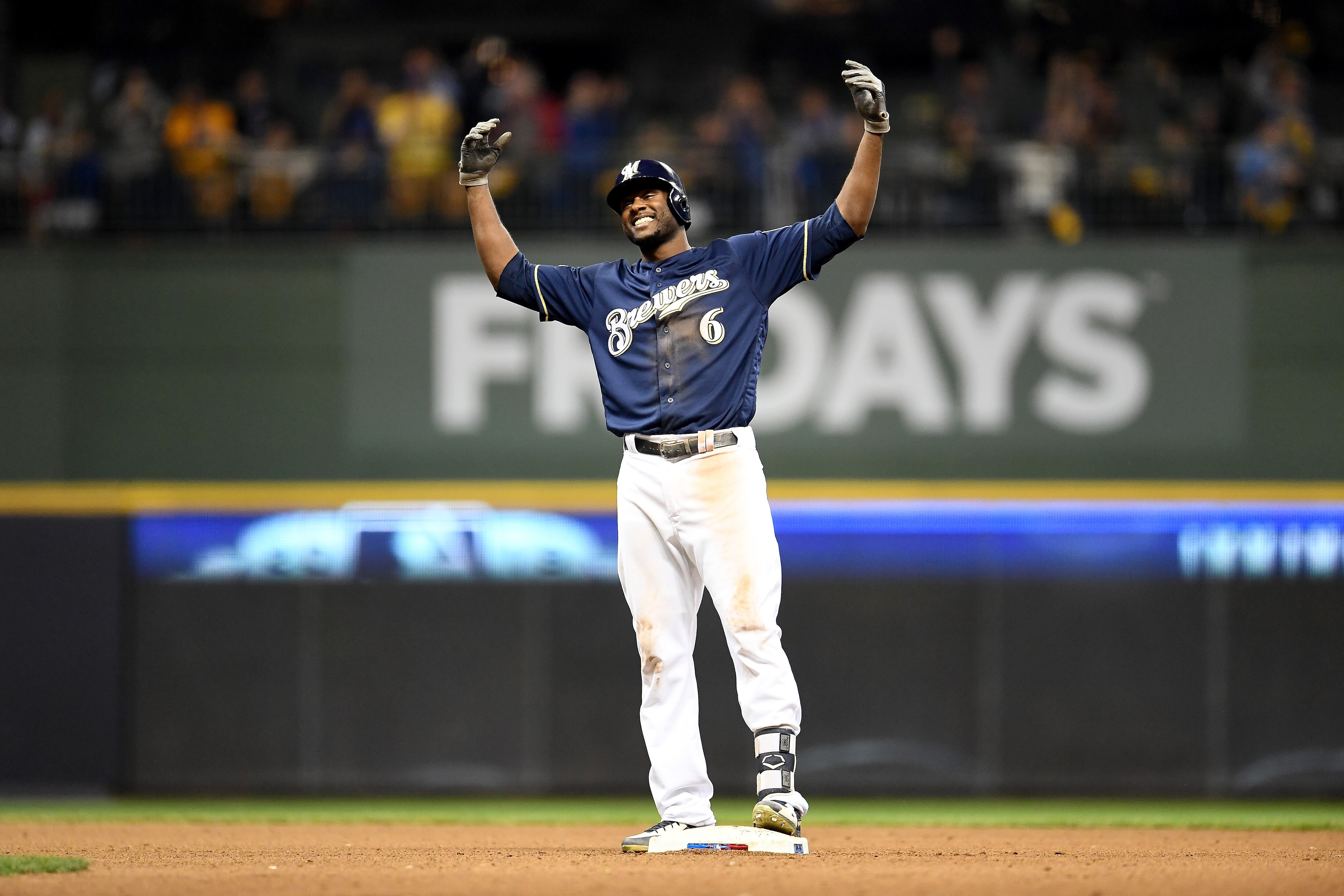 MILWAUKEE, WI - OCTOBER 12:  Lorenzo Cain #6 of the Milwaukee Brewers reacts after hitting a double against the Los Angeles Dodgers during the sixth inning in Game One of the National League Championship Series at Miller Park on October 12, 2018 in Milwaukee, Wisconsin.  (Photo by Stacy Revere/Getty Images)