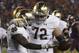 Notre Dame running back Dexter Williams, left, celebrates a touchdown with offensive lineman Robert Hainsey (72) during the second half of an NCAA college football game against Virginia Tech in Blacksburg, Va., Saturday, Oct. 6, 2018. Notre Dame won 45-23. (AP Photo/Steve Helber)