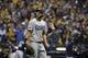 Los Angeles Dodgers starting pitcher Clayton Kershaw (22) walks after being removed from the game during the fourth inning of Game 1 of the National League Championship Series baseball game against the Milwaukee Brewers Friday, Oct. 12, 2018, in Milwaukee. (AP Photo/Jeff Roberson)