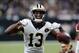 New Orleans Saints wide receiver Michael Thomas (13) reacts after a completion in the first half of an NFL football game against the Washington Redskins in New Orleans, Monday, Oct. 8, 2018. The Saints won 43-19. (AP Photo/Bill Feig)