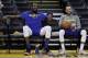 Golden State Warriors' Kevin Durant, left, and Stephen Curry smile as they take a break during an NBA basketball practice, Wednesday, May 30, 2018, in Oakland, Calif. The Warriors face the Cleveland Cavaliers in Game 1 of the NBA Finals on Thursday in Oakland. (AP Photo/Marcio Jose Sanchez)