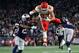 FOXBOROUGH, MA - OCTOBER 14: Travis Kelce #87 of the Kansas City Chiefs leaps by Duron Harmon #21 and Patrick Chung #23 of of the New England Patriots in the first quarter at Gillette Stadium in October 14, 2018 in Foxborough, Massachusetts. (Photo by Jim Rogash/Getty Images)