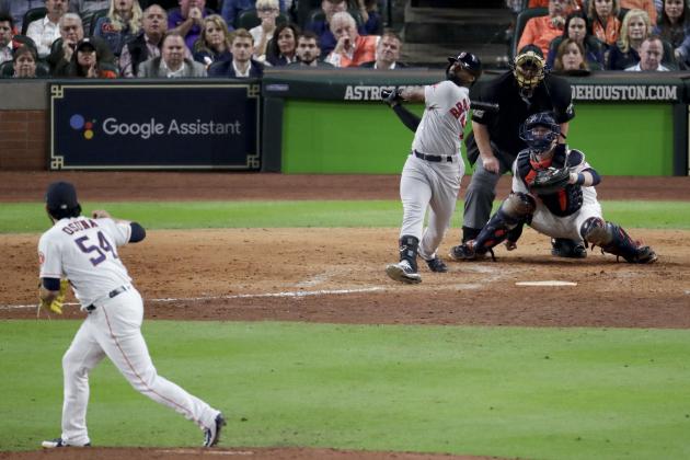 Boston Red Sox's Jackie Bradley Jr., right, watches his grand slam off Houston Astros relief pitcher Roberto Osuna during the eighth inning in Game 3 of a baseball American League Championship Series on Tuesday, Oct. 16, 2018, in Houston.(AP Photo/Lynne Sladky)