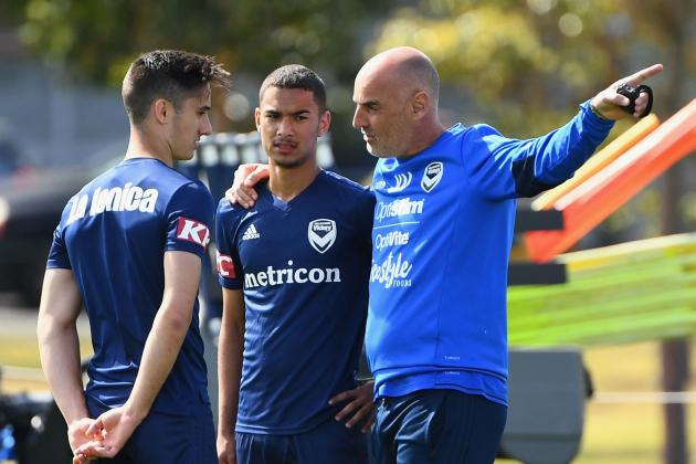 MELBOURNE, AUSTRALIA - OCTOBER 15: Kevin Muscat the coach of the Victory speaks to Nicholas Sette and Birkan Kirdar during a Melbourne Victory A-League training session at Gosch's Paddock on October 15, 2018 in Melbourne, Australia. (Photo by Quinn Rooney/Getty Images)