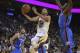 Golden State Warriors' Stephen Curry (30) lays up a shot past Oklahoma City Thunder forward Jerami Grant, right, during the second half of an NBA basketball game, Tuesday, Oct. 16, 2018, in Oakland, Calif. (AP Photo/Ben Margot)