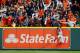 HOUSTON, TX - OCTOBER 17: A fan interferes with Mookie Betts #50 of the Boston Red Sox as he attempts to catch a ball hit by Jose Altuve #27 of the Houston Astros (not pictured) in the first inning during Game Four of the American League Championship Series at Minute Maid Park on October 17, 2018 in Houston, Texas. (Photo by Bob Levey/Getty Images)
