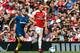 Arsenal's Welsh midfielder Aaron Ramsey (R) gets away from West Ham United's English midfielder Jack Wilshere (L) during the English Premier League football match between Arsenal and West Ham United at the Emirates Stadium in London on August 25, 2018. (Photo by Ian KINGTON / AFP) / RESTRICTED TO EDITORIAL USE. No use with unauthorized audio, video, data, fixture lists, club/league logos or 'live' services. Online in-match use limited to 120 images. An additional 40 images may be used in extra time. No video emulation. Social media in-match use limited to 120 images. An additional 40 images may be used in extra time. No use in betting publications, games or single club/league/player publications. / (Photo credit should read IAN KINGTON/AFP/Getty Images)