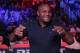 Daniel Cormier smiles for cameras during a mixed martial arts fight at Bellator 206 in San Jose, Calif., Saturday, Sept. 29, 2018. (AP Photo/Jeff Chiu)