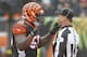 Cincinnati Bengals linebacker Vontaze Burfict (55) reacts with head linesman John McGrath (5) in the first half of an NFL football game against the Pittsburgh Steelers, Sunday, Oct. 14, 2018, in Cincinnati. (AP Photo/Gary Landers)