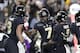 Purdue wide receiver Isaac Zico (7) celebrates a touchdown catch with running back Markell Jones (8) and wide receiver Rondale Moore (4) during the first half of an NCAA college football game against Ohio State in West Lafayette, Ind., Saturday, Oct. 20, 2018. (AP Photo/Michael Conroy)
