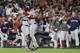 CORRECTS THE NAME OF THE CATCHER TO SANDY LEON, AND NOT CHRISTIAN VAZQUEZ AS ORIGINALLY SENT - Boston Red Sox relief pitcher Craig Kimbrel celebrates with catcher Sandy Leon after winning the baseball American League Championship Series against the Houston Astros on Thursday, Oct. 18, 2018, in Houston. (AP Photo/David J. Phillip)
