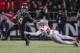 WEST LAFAYETTE, IN - OCTOBER 20: Rondale Moore #4 of the Purdue Boilermakers runs the ball and tries to fight off Jahsen Wint #23 of the Ohio State Buckeyes at Ross-Ade Stadium on October 20, 2018 in West Lafayette, Indiana. (Photo by Michael Hickey/Getty Images)