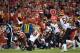 Kansas City Chiefs running back Kareem Hunt (27) vaults over Cincinnati Bengals safety Jessie Bates (30) during the first half of an NFL football game in Kansas City, Mo., Sunday, Oct. 21, 2018. (AP Photo/Reed Hoffmann)
