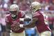 Florida State's Jacques Patrick takes a hand off from quarterback Deondre Francois in the first quarter of an NCAA college football game with Wake Forest, Saturday, Oct. 20, 2018 in Tallahassee, Fla. (AP Photo/Steve Cannon)