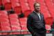 Oakland Raiders head coach Jon Gruden watches as his team warms-up before an NFL football game against Seattle Seahawks at Wembley stadium in London, Sunday, Oct. 14, 2018. (AP Photo/Matt Dunham)