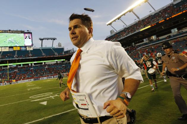 Miami head coach Al Golden runs onto the field after his team defeated Virginia Tech 30-20 in an NCAA college football game, Saturday, Oct. 17, 2015, in Miami Gardens, Fla. (AP Photo/Joe Skipper)
