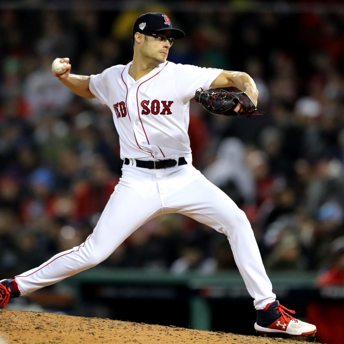 Red Sox reliever Nathan Eovaldi throws a strike to Dodgers Yasiel Puig