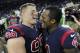 Houston Texans defensive end, J.J. Watt (99) and quarterback Deshaun Watson (4) celebrate their victory over the Miami Dolphins in an NFL football game on Thursday, Oct. 25, 2018 in Houston. (AP Photo / Eric Christian Smith)