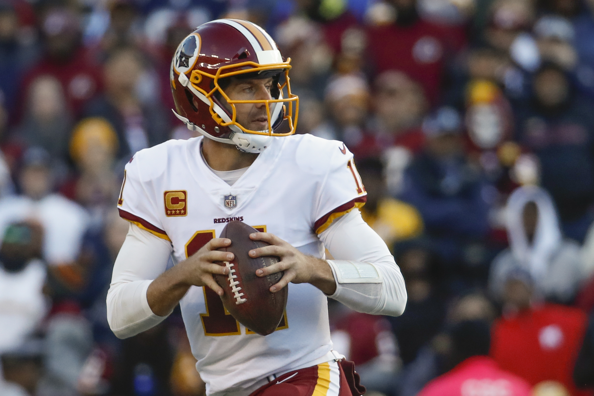 Alex Smith of the Washington Redskins is helped off the field