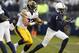 Penn State's KJ Hamler (1) runs out of bounds after a catch as Iowa's Amani Hooker (27) defends during the first half of an NCAA college football game in State College, Pa., Saturday, Oct. 27, 2018. (AP Photo/Chris Knight)