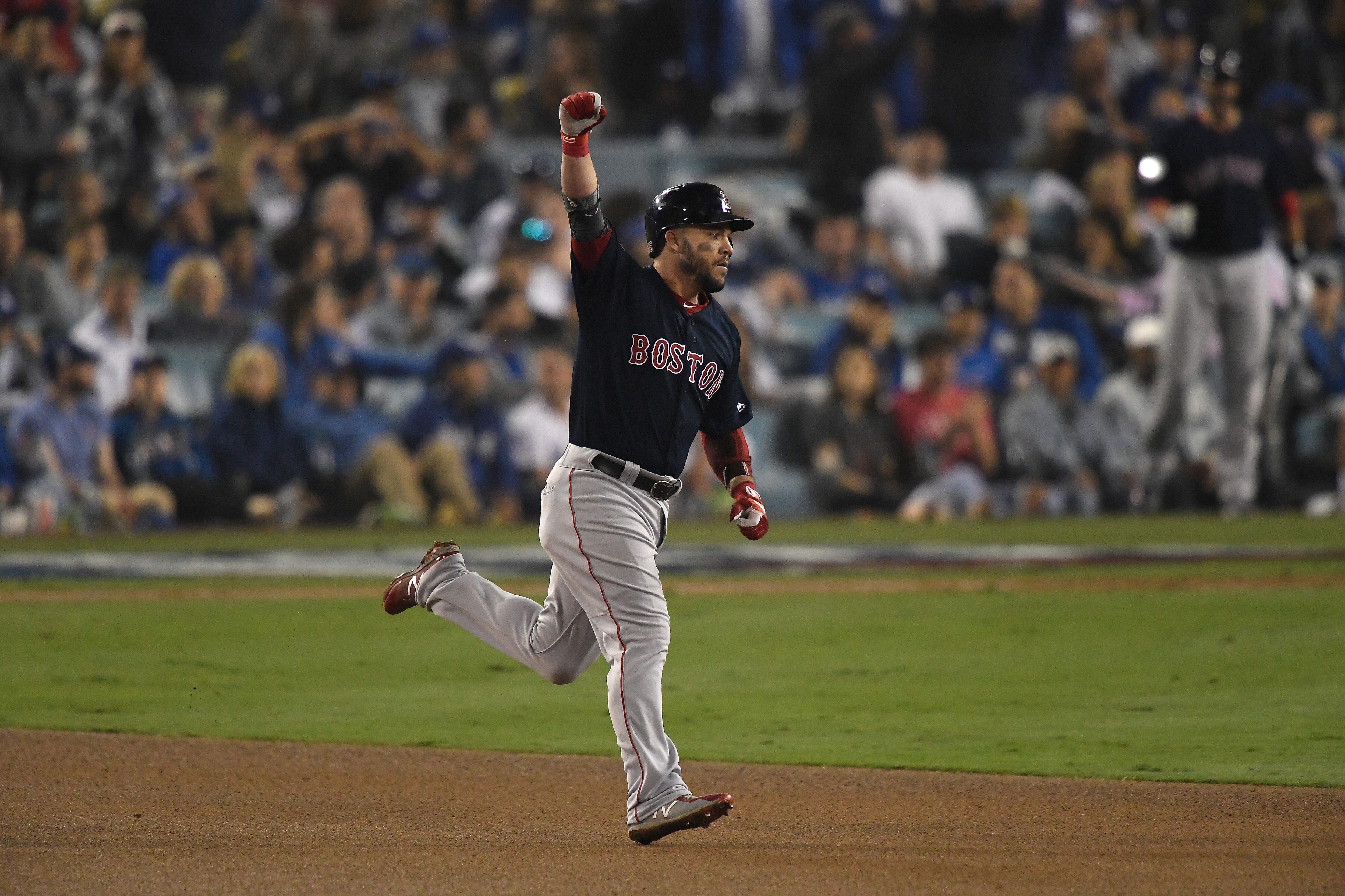 LOS ANGELES, CA - OCTOBER 27:  Steve Pearce #25 of the Boston Red Sox celebrates on his way to second base after hitting a solo home run in the eighth inning of Game Four of the 2018 World Series against pitcher Kenley Jansen #74 of the Los Angeles Dodgers (not in photo) at Dodger Stadium on October 27, 2018 in Los Angeles, California.  (Photo by Kevork Djansezian/Getty Images)