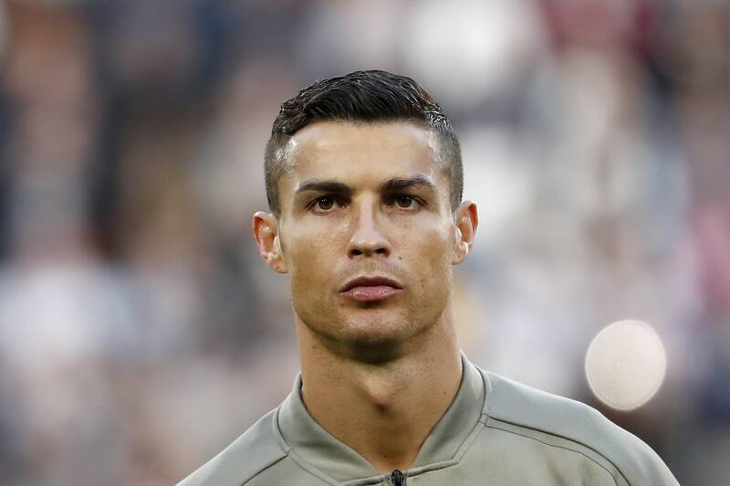 Juventus' Cristiano Ronaldo stands prior to the start of the Serie A soccer match between Juventus and Genoa at the Allianz stadium, in Turin, Italy, Saturday, Oct. 20, 2018. (AP Photo/Antonio Calanni)
