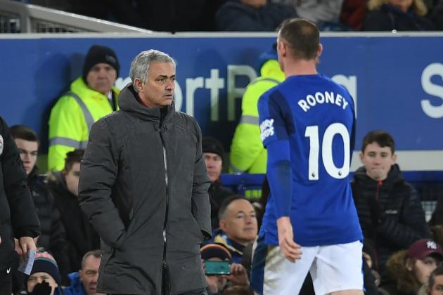 Everton's English striker Wayne Rooney (R) walks past Manchester United's Portuguese manager Jose Mourinho as he leaves the field during the English Premier League football match between Everton and Manchester United at Goodison Park in Liverpool, north west England on January 1, 2018. / AFP PHOTO / Paul ELLIS / RESTRICTED TO EDITORIAL USE. No use with unauthorized audio, video, data, fixture lists, club/league logos or 'live' services. Online in-match use limited to 75 images, no video emulation. No use in betting, games or single club/league/player publications.  /         (Photo credit should read PAUL ELLIS/AFP/Getty Images)