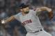 Boston Red Sox starting pitcher Nathan Eovaldi delivers against the New York Yankees during the first inning of Game 3 of baseball's American League Division Series, Monday, Oct. 8, 2018, in New York. (AP Photo/Julie Jacobson)