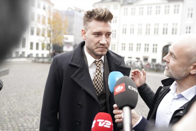 Rosenborg's Danish football player Nicklas Bendtner and lawyer Anders Nemeth talk to the media as they arrive for a hearing at Copenhagen City Council on November 2, 2018. - Nicklas Bendtner has been charged with violence against a taxi driver in Copenhagen while the driver has been charged with attempted violence. (Photo by Martin Sylvest / Ritzau Scanpix / AFP) / Denmark OUT (Photo credit should read MARTIN SYLVEST/AFP/Getty Images)